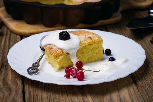Freshly baked pudding with berries, closeup