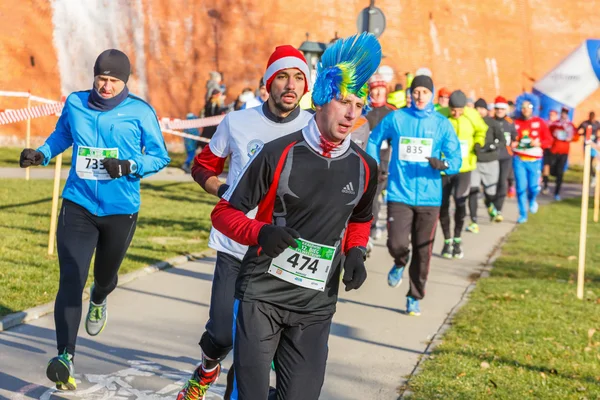 Krakow, Poland - December 31, 2015: 12th New Year\'s Eve Race in Krakow. The people running dressed in funny costumes