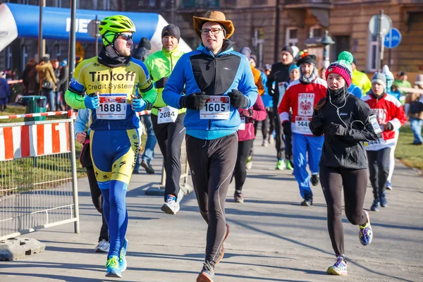 Krakow, Poland - December 31, 2015: 12th New Year\'s Eve Race in Krakow. The people running dressed in funny costumes