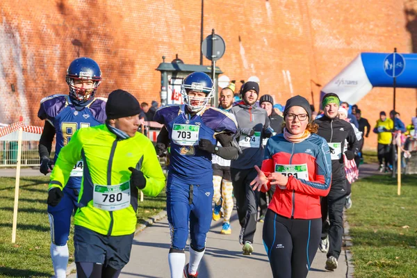 Krakow, Poland - December 31, 2015: 12th New Year\'s Eve Race in Krakow. The people running dressed in funny costumes