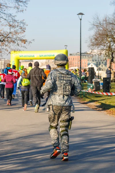 Krakow, Poland - December 31, 2015: 12th New Year\'s Eve Race in Krakow. The people running dressed in funny costumes