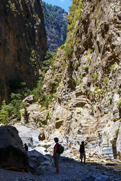 Samaria Gorge, Grece - MAY 26, 2016: Tourists hike in Samaria Gorge in central Crete, Greece. The national park is a UNESCO Biosphere Reserve since 1981