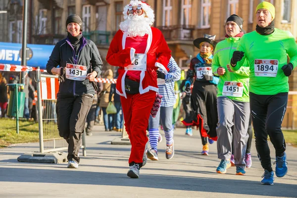 Krakow, Poland - December 31, 2015: 12th New Year\'s Eve Race in Krakow. The people running dressed in funny costumes