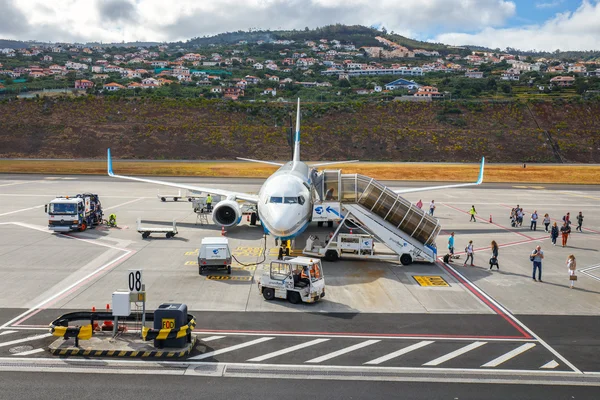 Funchal, Madeira - July 6, 2016: Enter Air Boeing 737 at Funchal Cristiano Ronaldo Airport, boarding passengers.This airport is one of the most dangerous airports in Europe