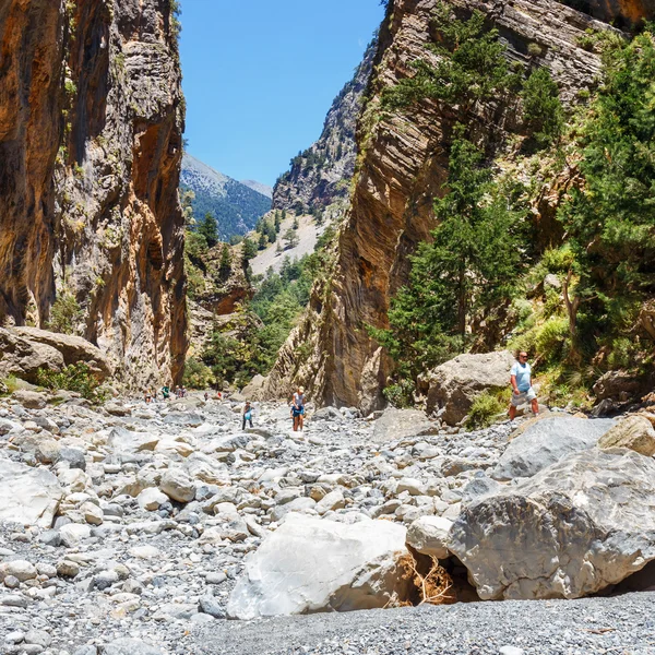 Samaria Gorge, Greece - MAY 26, 2016: Tourists hike in Samaria Gorge in central Crete, Greece. The national park is a UNESCO Biosphere Reserve since 1981