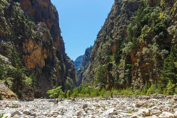 Samaria Gorge, Greece - MAY 26, 2016: Tourists hike in Samaria Gorge in central Crete, Greece. The national park is a UNESCO Biosphere Reserve since 1981