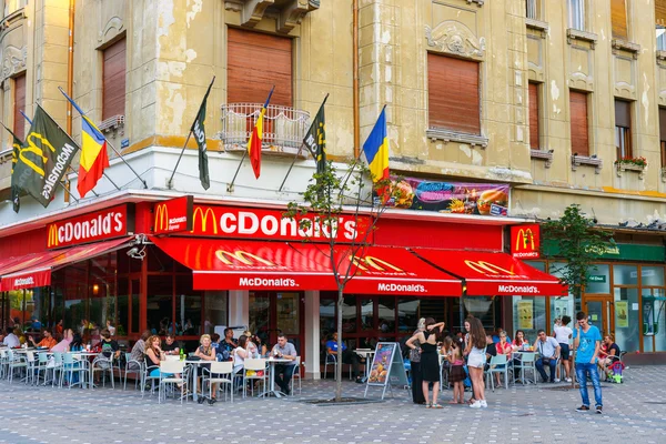 TIMISOARA, ROMANIA - JULY 22, 2014: McDonalds restaurant at Pia?a Victoriei, Timisoara, Romania. Mc Donalds is the world biggest fast food chain.