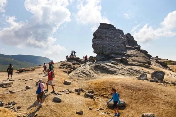 Bucegi Mountains, Romania July 09, 2015: Unidentified group of bikers climbs the hill in Bucegi Mountains in Romania on July 09, 2015.