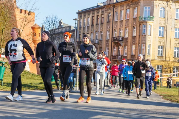 Krakow, Poland - December 31, 2015: 12th New Year\'s Eve Race in Krakow. The people running dressed in funny costumes