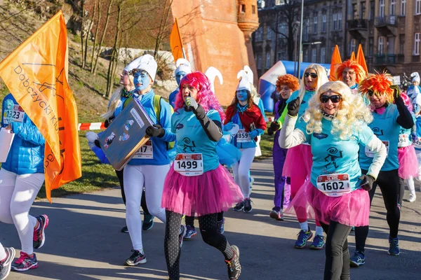 Krakow, Poland - December 31, 2015: 12th New Year\'s Eve Race in Krakow. The people running dressed in funny costumes