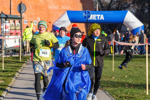 Krakow, Poland - December 31, 2015: 12th New Year's Eve Race in Krakow. The people running dressed in funny costumes