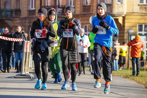 Krakow, Poland - December 31, 2015: 12th New Year\'s Eve Race in Krakow. The people running dressed in funny costumes