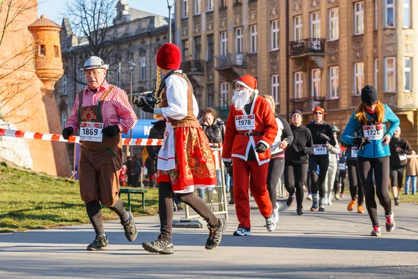 Krakow, Poland - December 31, 2015: 12th New Year\'s Eve Race in Krakow. The people running dressed in funny costumes