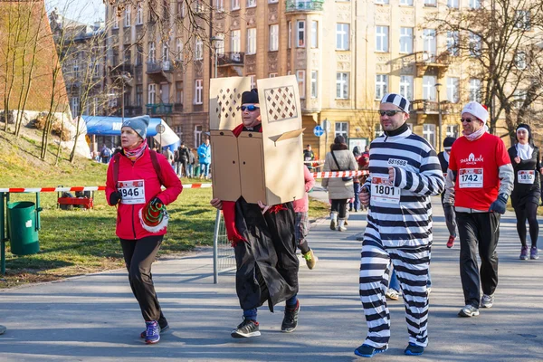 Krakow, Poland - December 31, 2015: 12th New Year\'s Eve Race in Krakow. The people running dressed in funny costumes