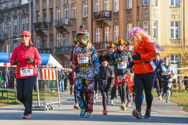 Krakow, Poland - December 31, 2015: 12th New Year\'s Eve Race in Krakow. The people running dressed in funny costumes