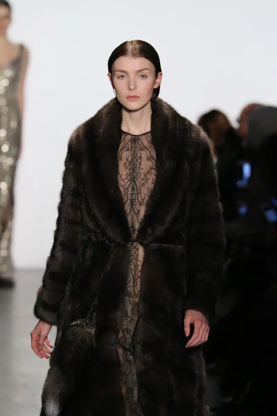 Model walks the runway wearing Dennis Basso Fall 2016