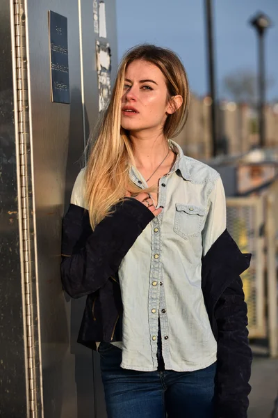 Model in denim shirt and jeans