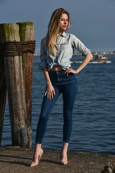 Model in denim shirt and jeans