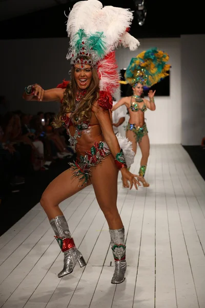 Brazilian dancers performs on the runway
