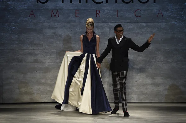 Designer B. Michael and model Elena Kurnosova walk the runway at the B. Michael America fashion show