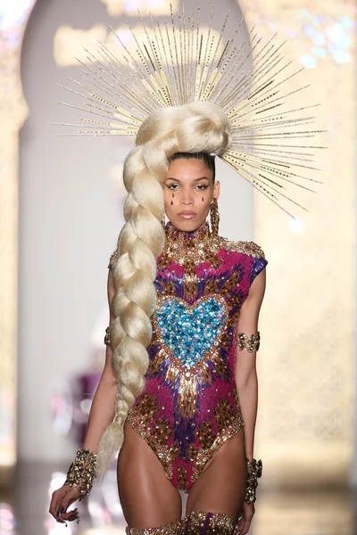 Model walks the runway during The Blonds 2015 fashion show