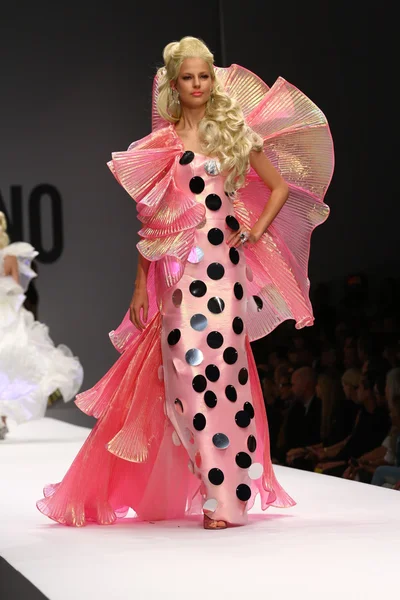 Model walks the runway during the Moschino show