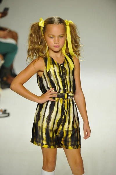 Model walks the runway during the Alivia Simone preview at petite PARADE Kids Fashion Week