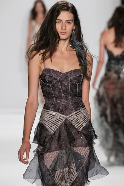 Model walks the runway at the Badgley Mischka fashion show