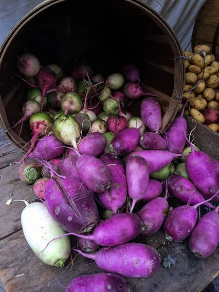 Yellow and purple radish at the farmers Market