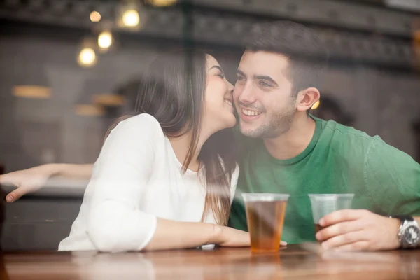Girl drinking beer with a guy