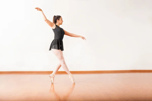 Female ballet dancer tip toeing
