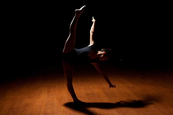 Dancer standing in a spotlight