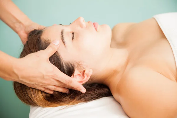 Woman getting a head massage