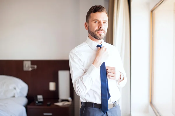 Young attorney getting dressed