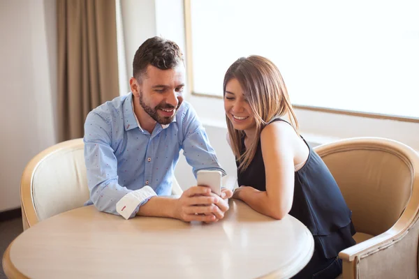 Couple looking at some photos