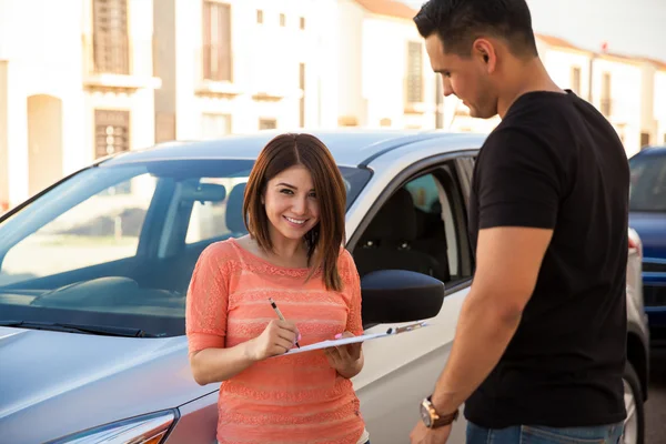 Woman signing a financing plan