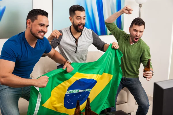 Guys cheering for Brazil