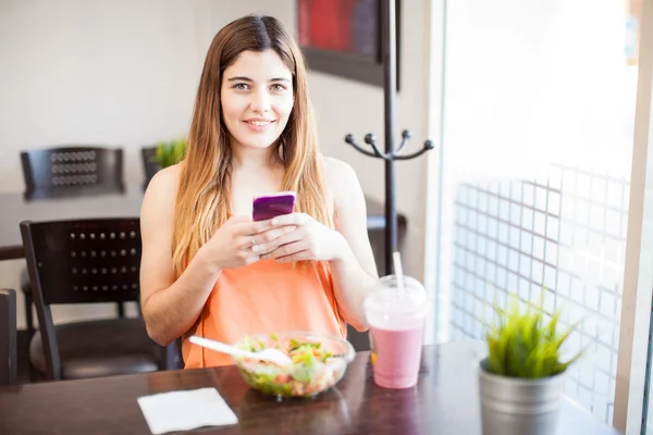 Woman updating her social media status