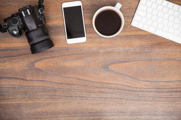 Photographers desk with a digital camera