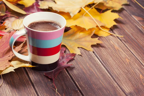 Coffee cup in autumn