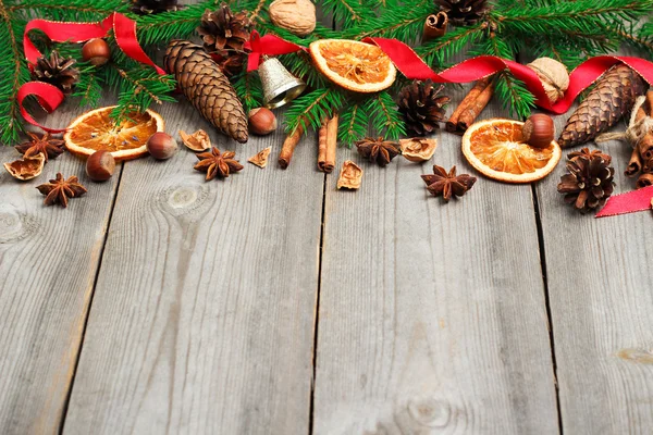 Christmas decoration with fir tree, oranges, cones, spices