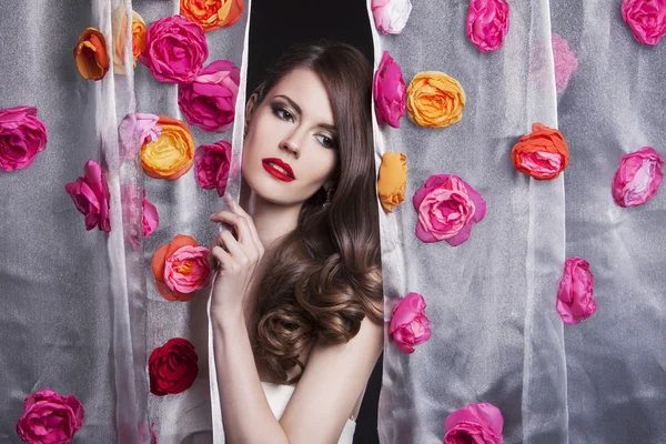 Beauty fashion model girl portrait with flowers. Beautiful luxury makeup and hair