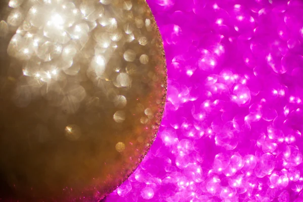 Close up of golden christmas ball on glitter background