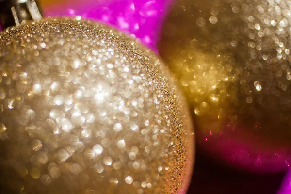 Golden christmas ball on glitter background