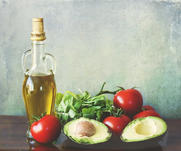 Olive oil and salad ingredients