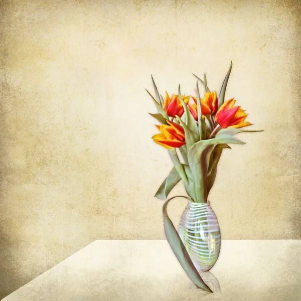 Grunge stil life, vase of tulips on a table