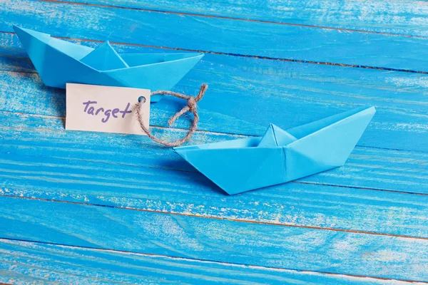 Paper Boat with a sign Target - travel concept