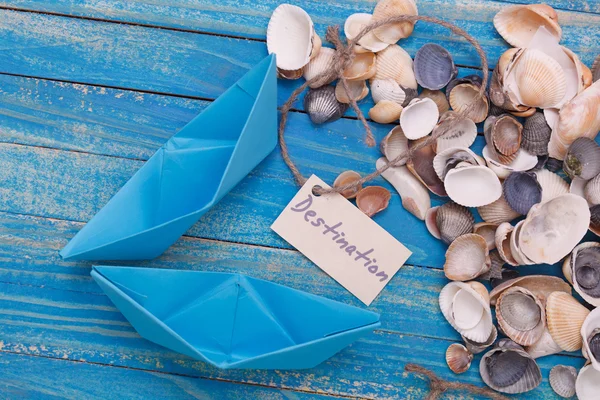 Paper Boat with a sign Destination - travel concept