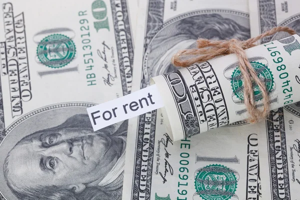 Money and business idea, The dollar bills tied with a rope, with a sign - For Rent