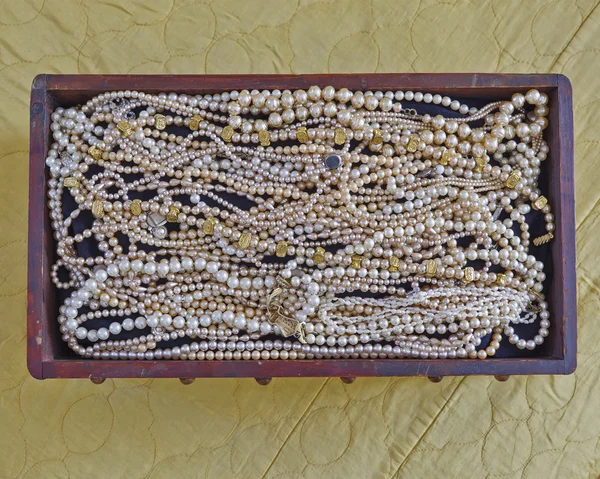 Pearls in vintage wooden crib